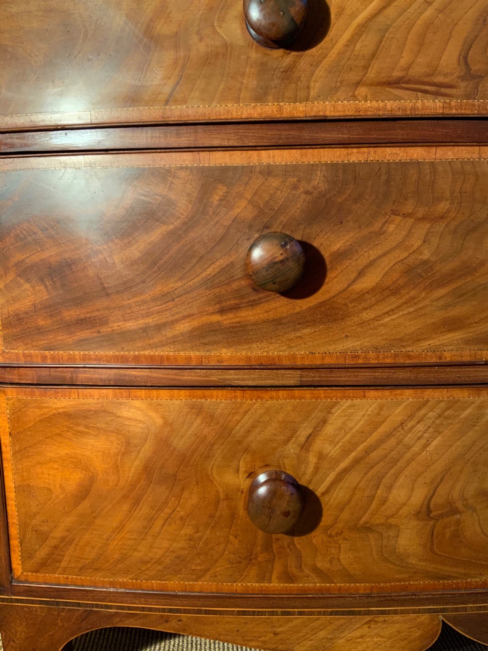 A  Georgian bow front mahogany linen press View III