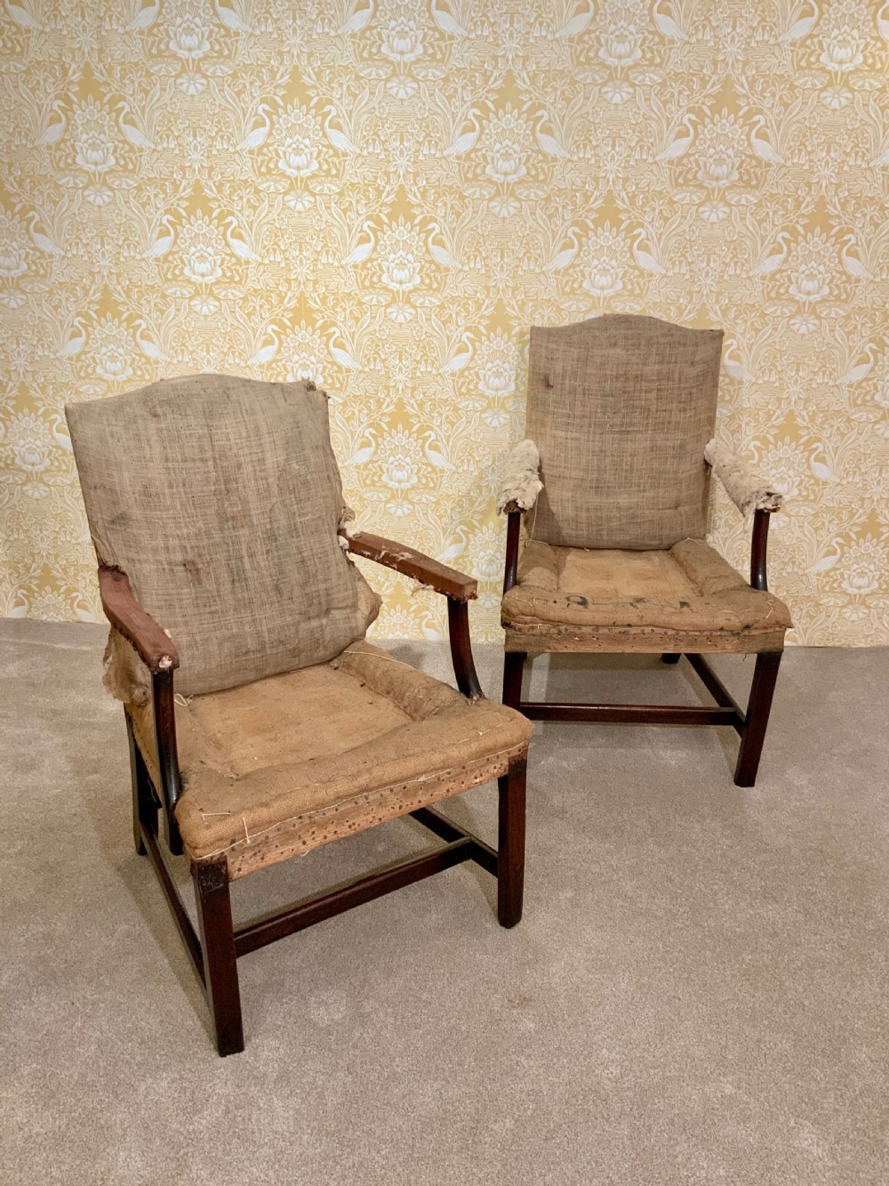 A pair of 18th century Gainsborough arm chairs