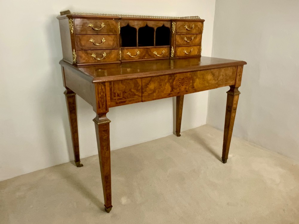 A 19th century burr walnut writing table