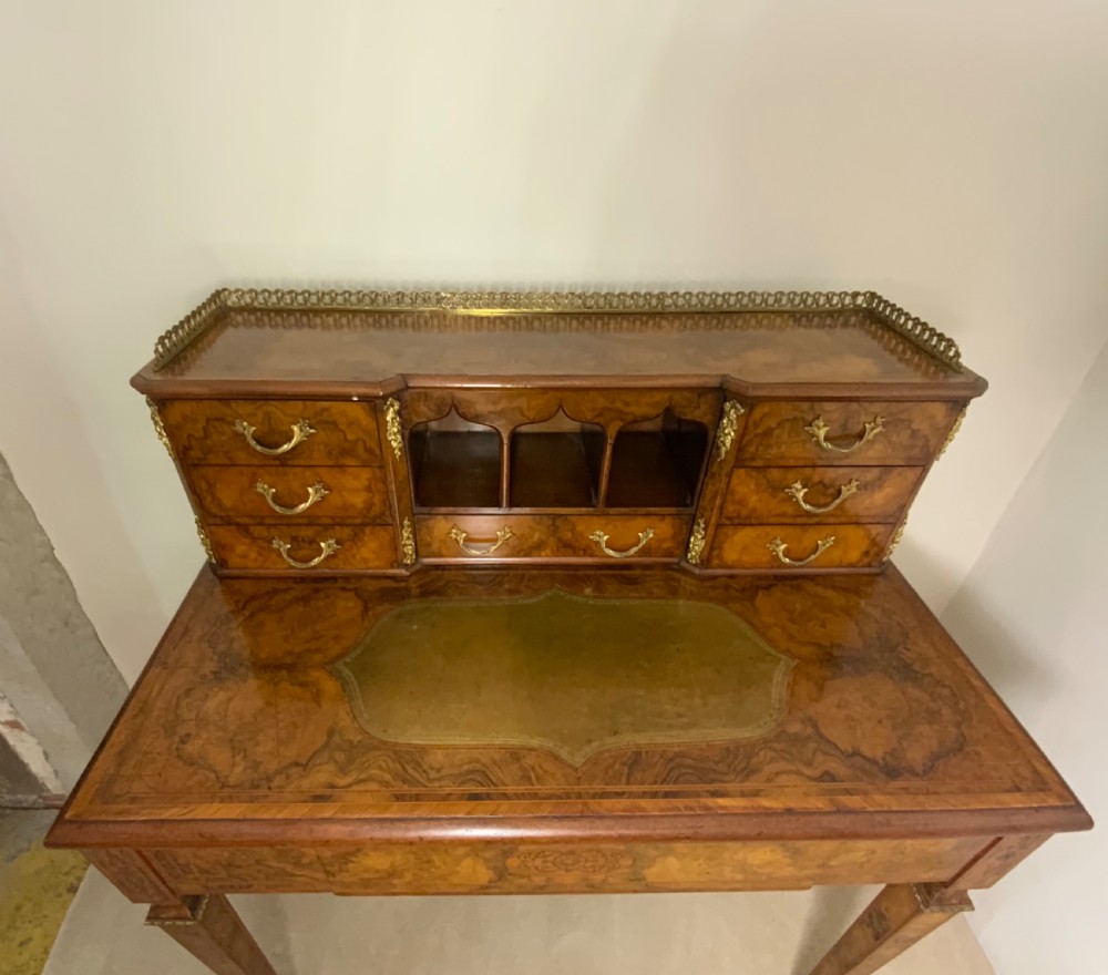A 19th century burr walnut writing table View VI