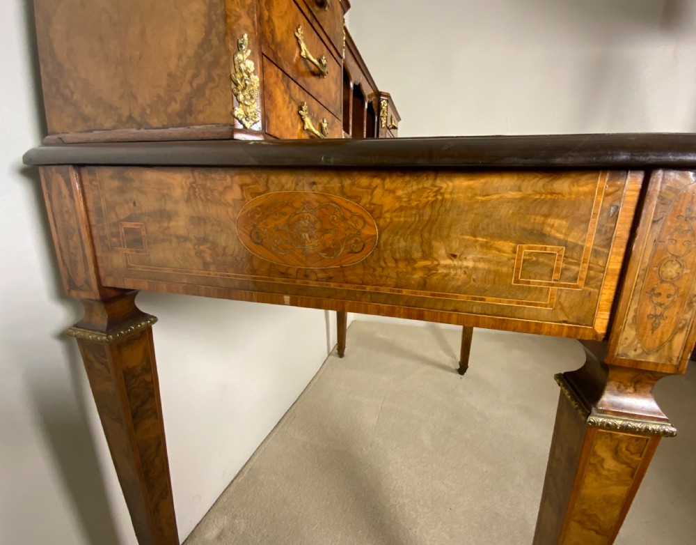 A 19th century burr walnut writing table View IX