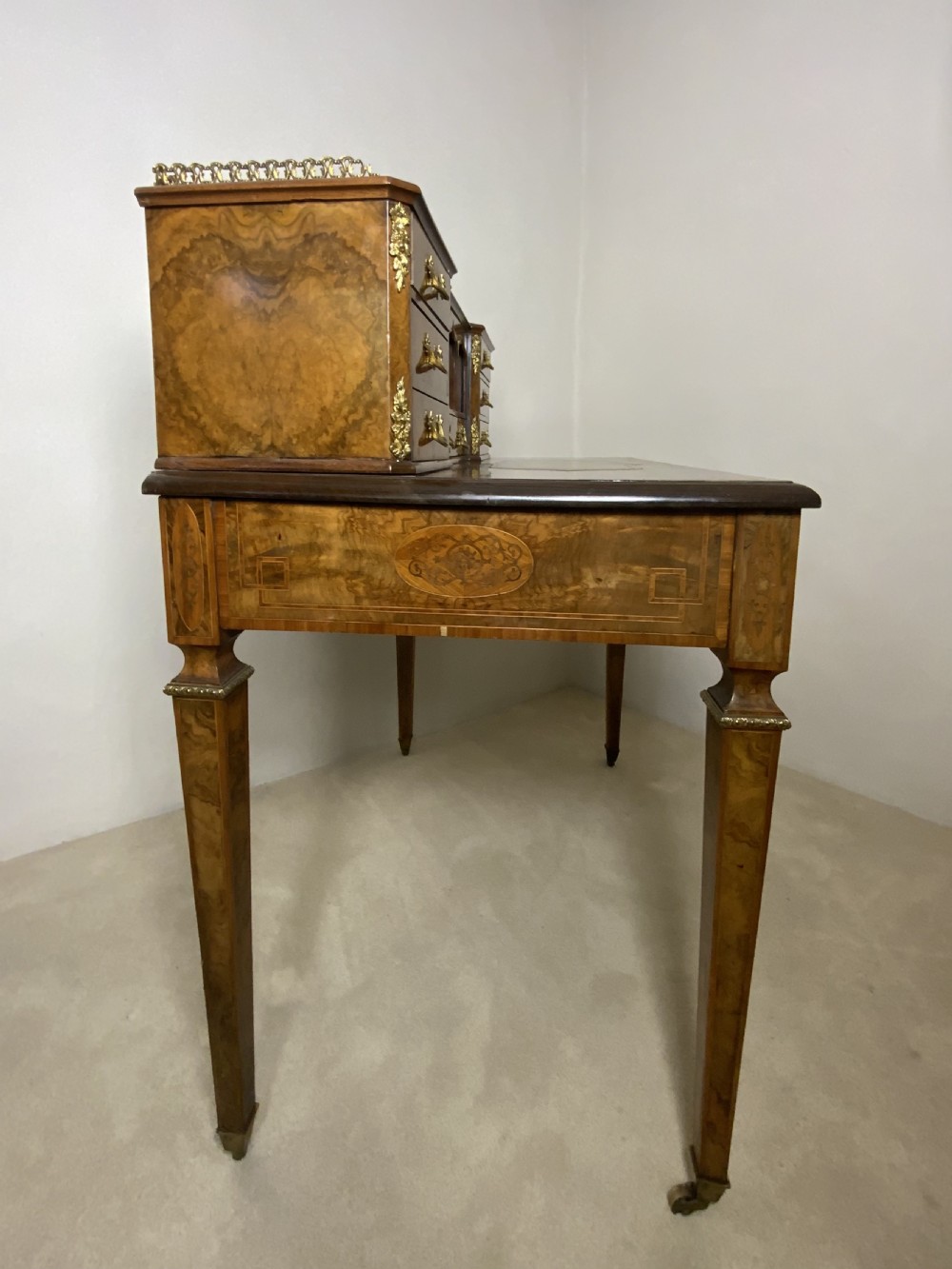 A 19th century burr walnut writing table View X
