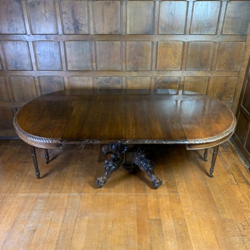 EXTENDING OAK DINING TABLE WITH CARVED BASE - ADDITIONAL PHOTO 1