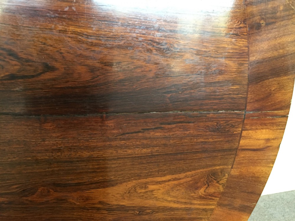 Circular rosewood breakfast or centre table with calamander crossbanding  View X