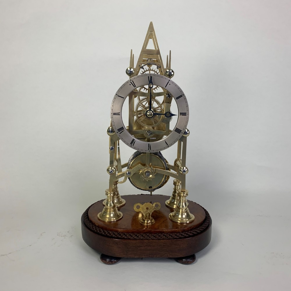 Brass skeleton clock in glass dome View II