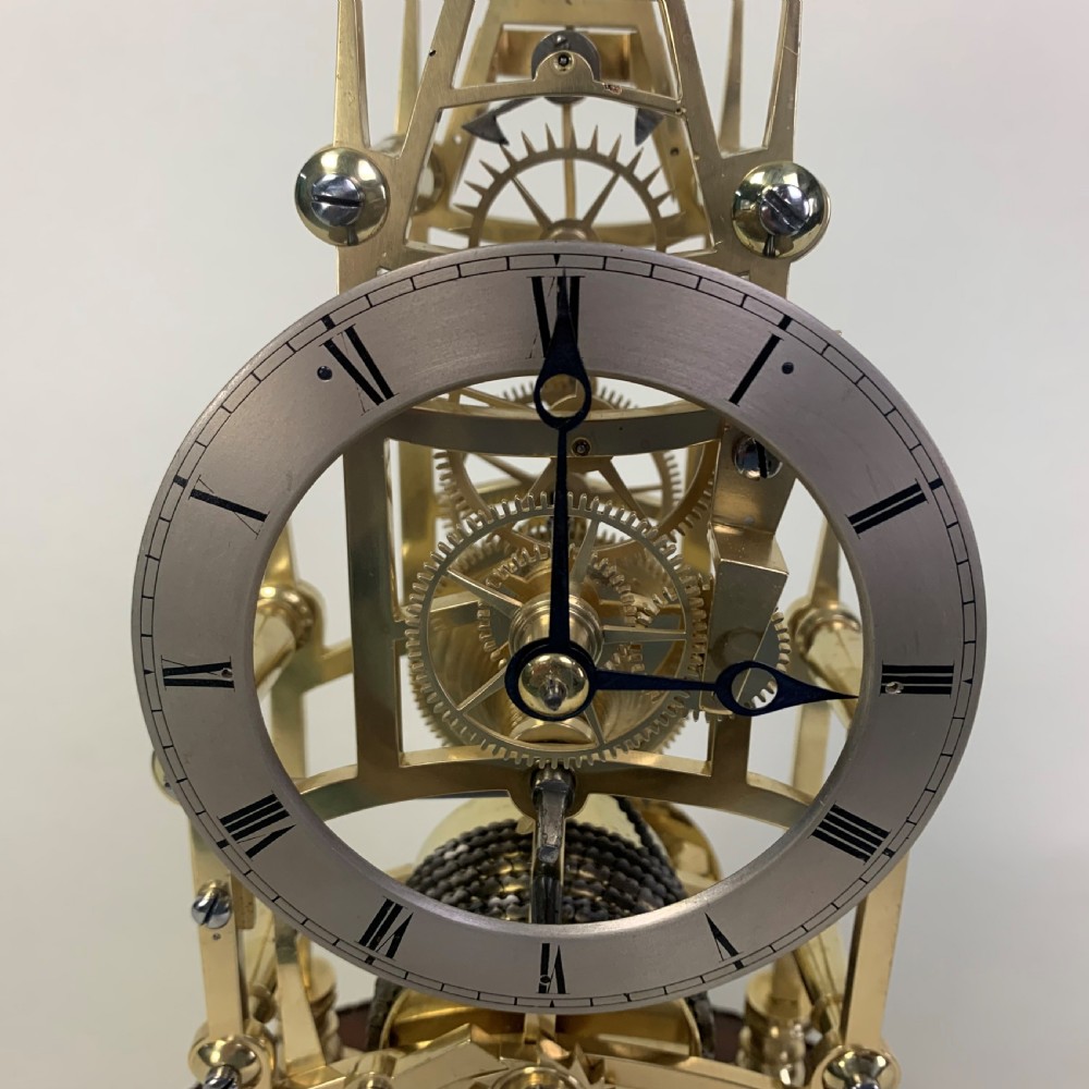 Brass skeleton clock in glass dome View III
