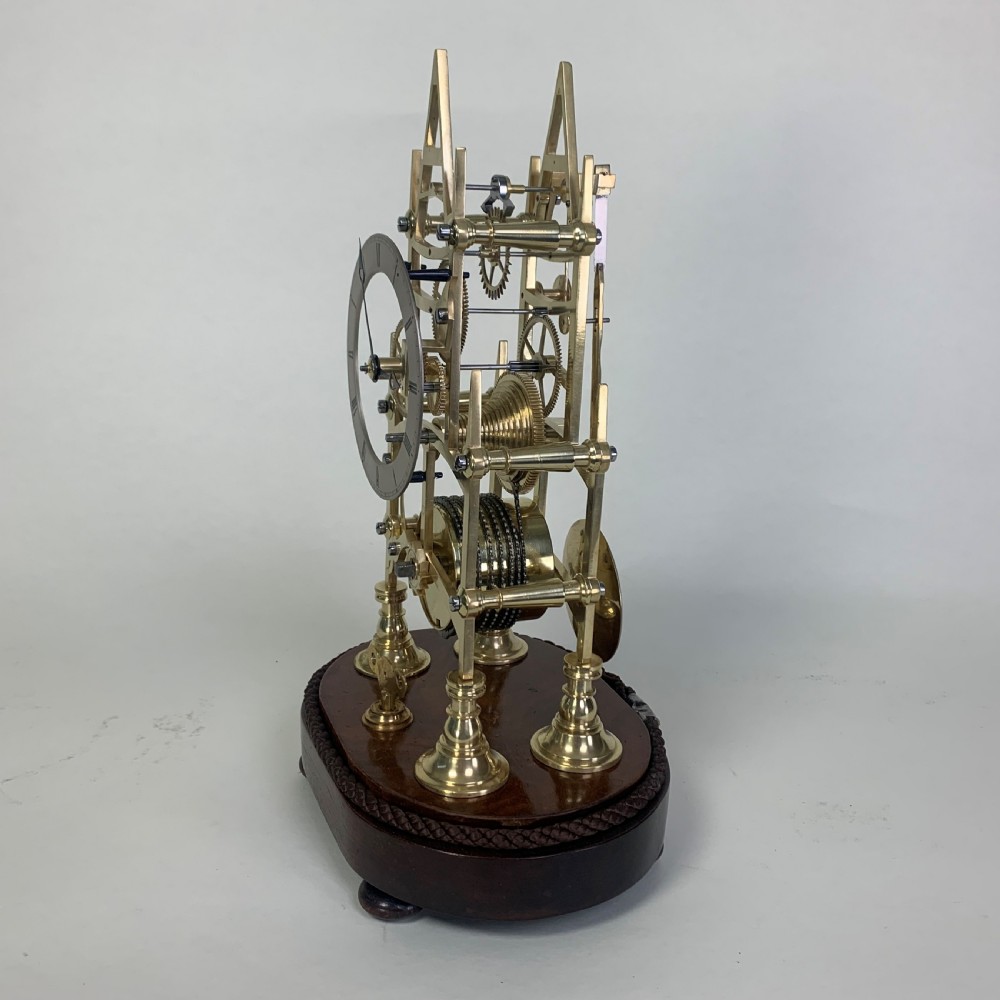 Brass skeleton clock in glass dome View IV