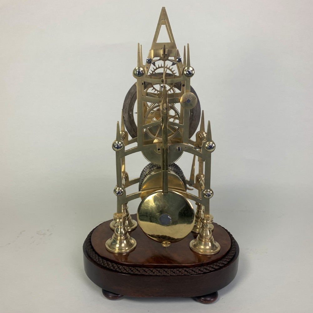 Brass skeleton clock in glass dome View V