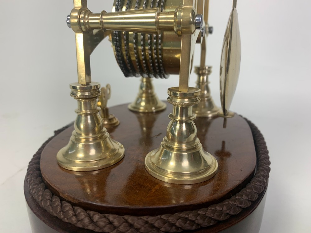 Brass skeleton clock in glass dome View VI