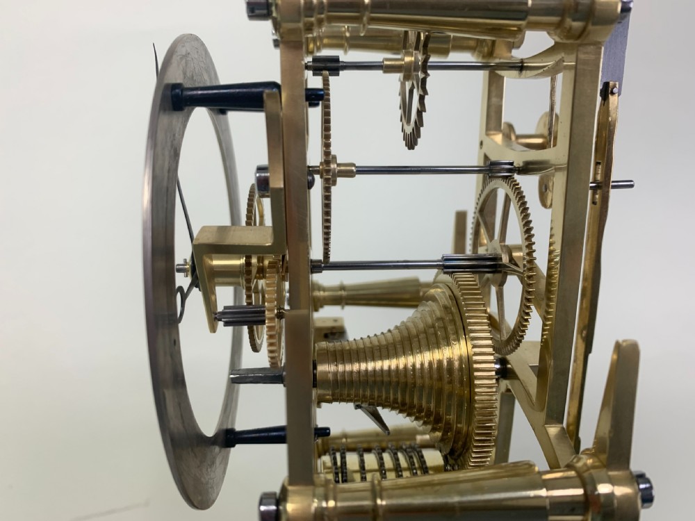 Brass skeleton clock in glass dome View VII