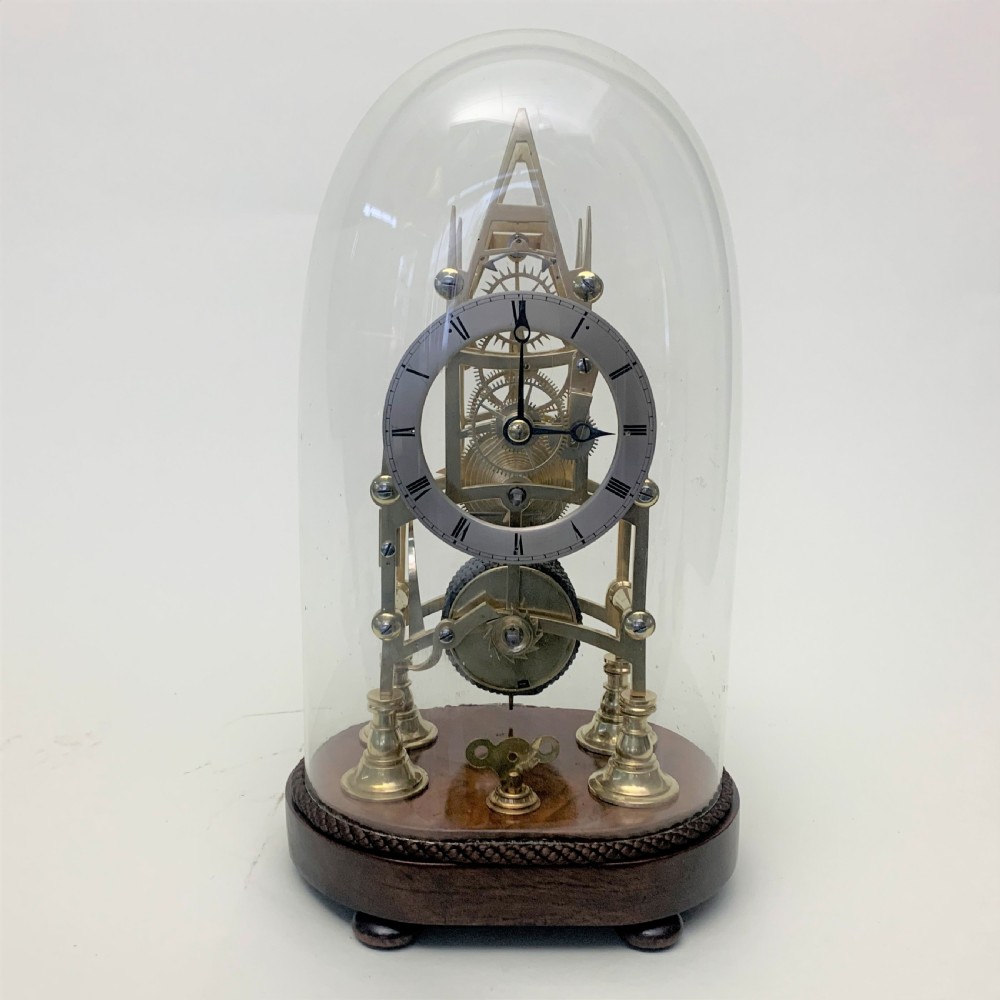 Brass skeleton clock in glass dome View VIII