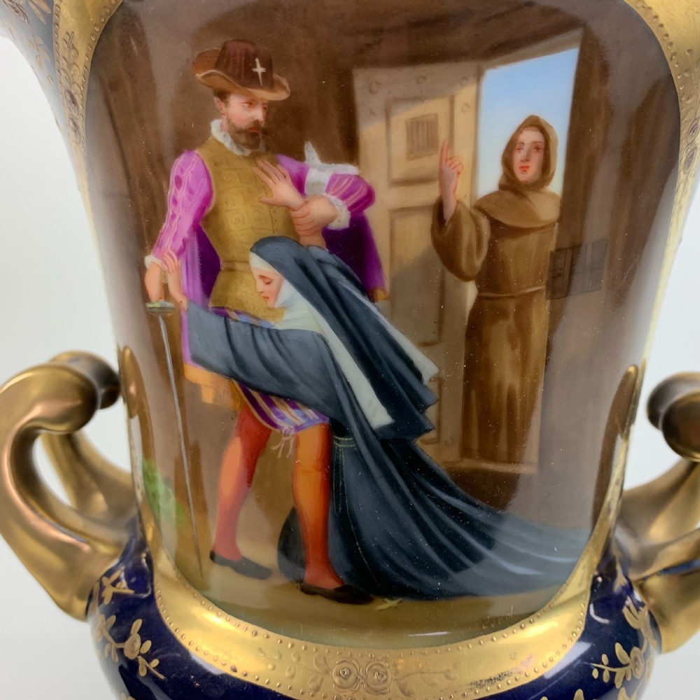 A pair of cobalt blue and gold Vienna porcelain urns with hand-painted classical scenes on square plinths. View VI