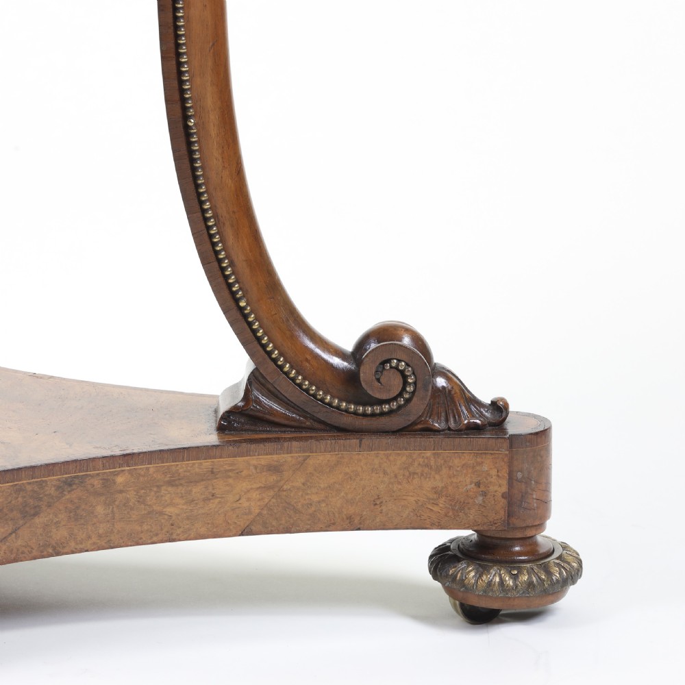 A circular occasional table featuring a reddish-pink marble top supported by a burr walnut frame with scrolled legs and a tripartite base. View IV