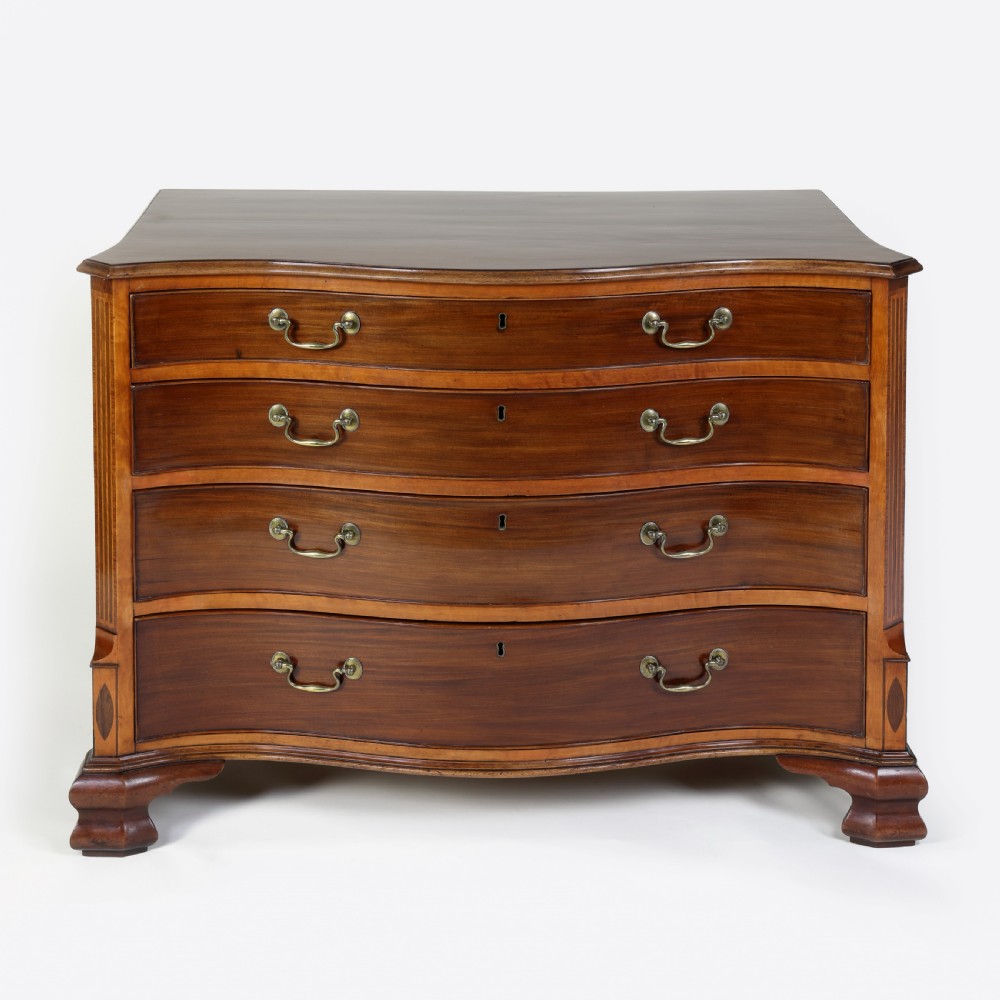 Georgian serpentine shaped mahogany and satinwood chest of drawers View III