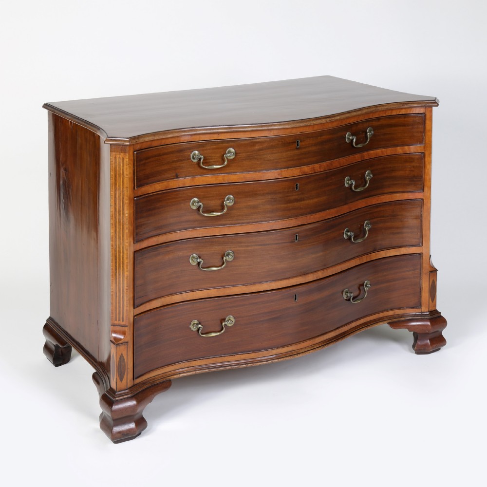 Georgian serpentine shaped mahogany and satinwood chest of drawers View IV