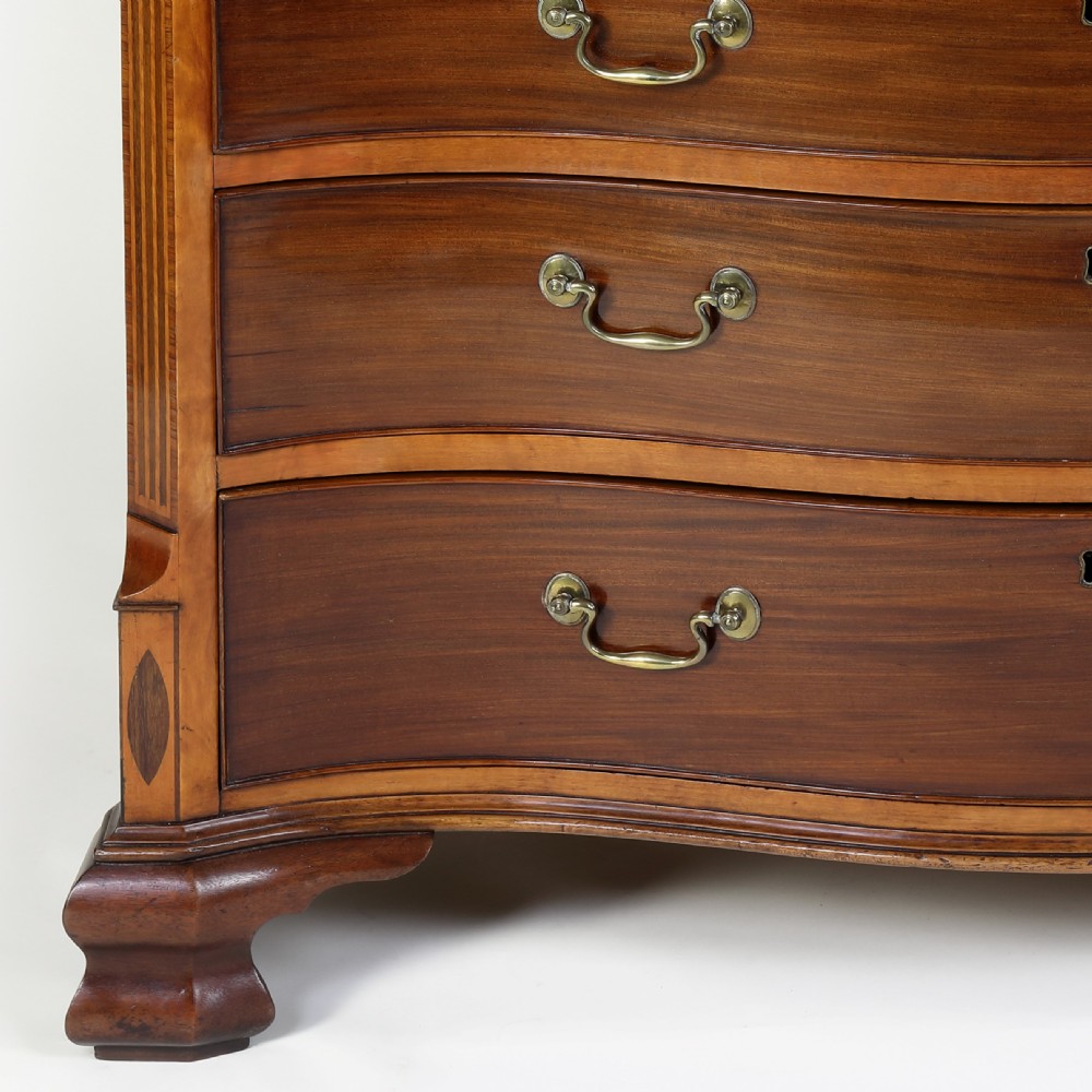 Georgian serpentine shaped mahogany and satinwood chest of drawers View V