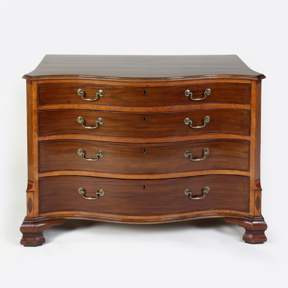 Georgian serpentine shaped mahogany and satinwood chest of drawers View IX
