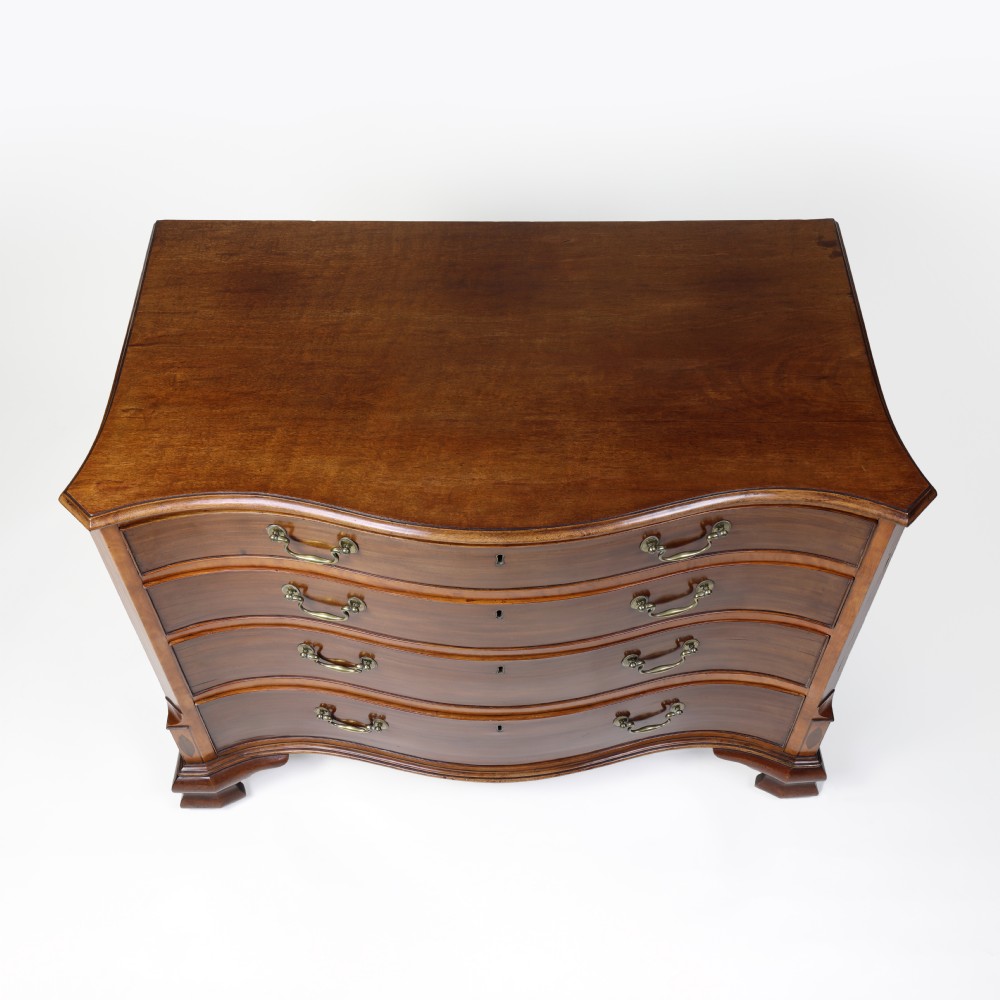 Georgian serpentine shaped mahogany and satinwood chest of drawers View XVII
