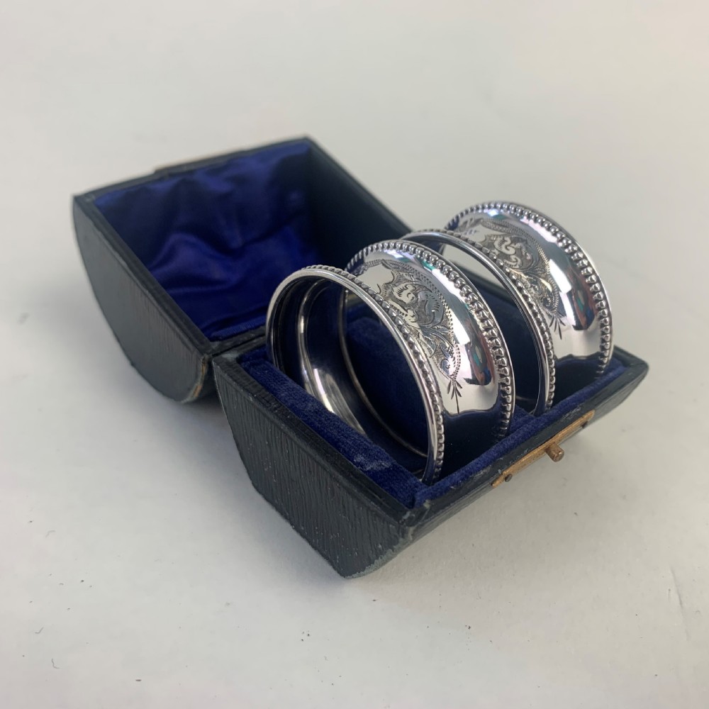 Pair of cased silver napkin rings