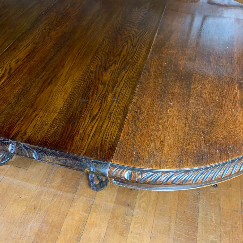 Extending Oak Dining Table with carved base View IV