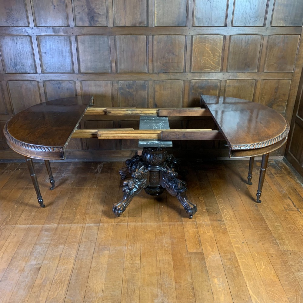 Extending Oak Dining Table with carved base View VI