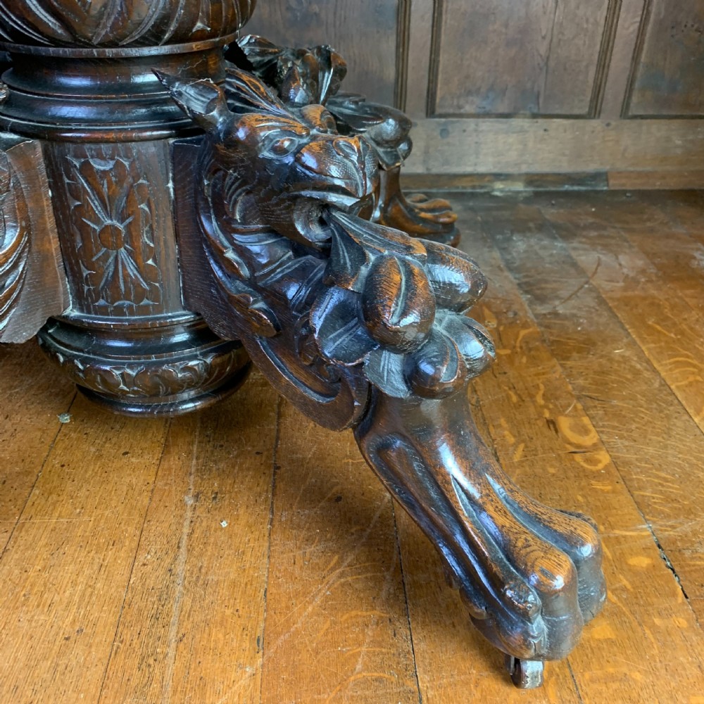 Extending Oak Dining Table with carved base View VIII