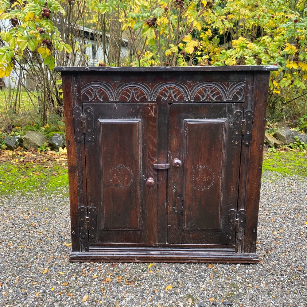 Small carved Oak Cupboard dated 1680