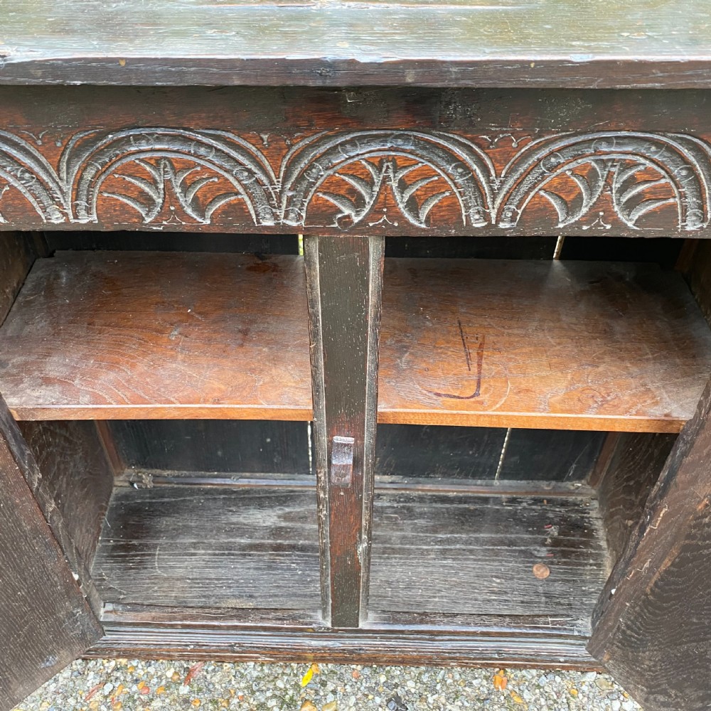 Small carved Oak Cupboard dated 1680 View II