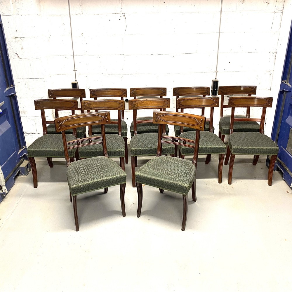 Set of twelve 12/10 ten Regency period mahogany dining chairs