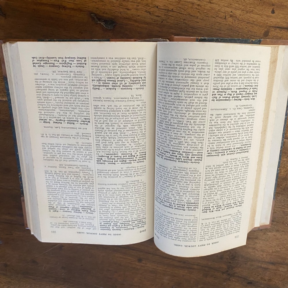 A continuous shelf run of uniform antique leather-bound Law Journal Reports featuring tan calfskin spines, contrasting red and dark labels, and gilt lettering. View IV