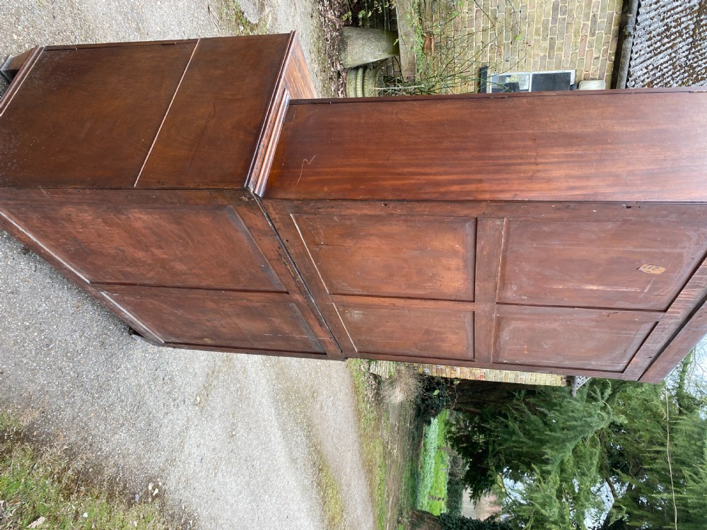 George IV mahogany secretaire bookcase with gothic arch astragal glazed upper doors, a deep secretaire drawer, and a lower two-door cupboard. View XI