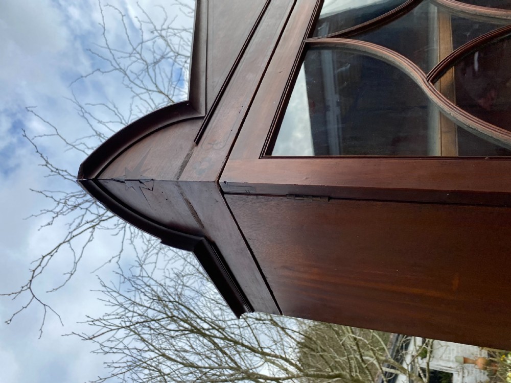 George IV mahogany secretaire bookcase with gothic arch astragal glazed upper doors, a deep secretaire drawer, and a lower two-door cupboard. View XVI
