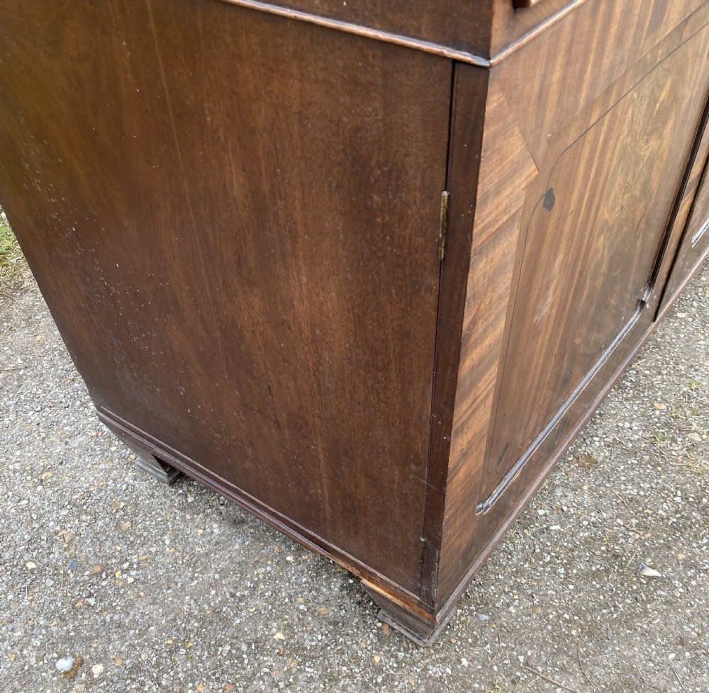 George IV mahogany secretaire bookcase with gothic arch astragal glazed upper doors, a deep secretaire drawer, and a lower two-door cupboard. View XIX