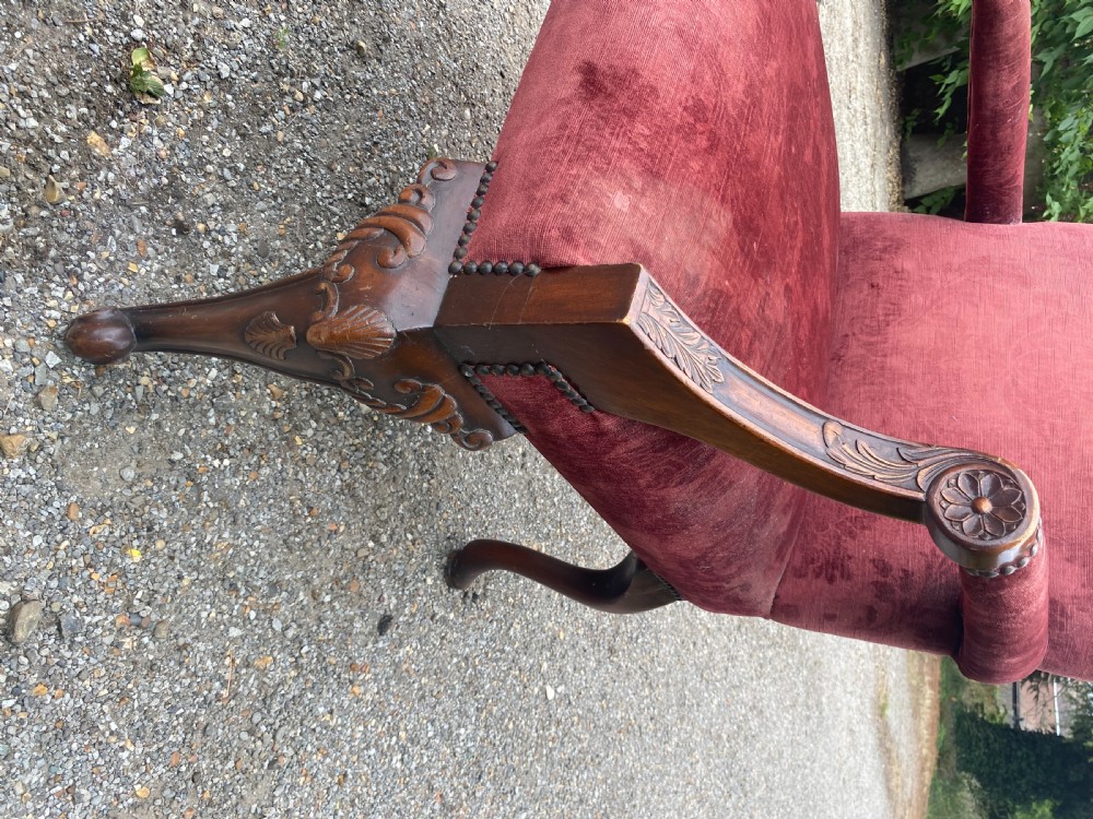 A 19th-century George III style Gainsborough armchair featuring rose pink velvet upholstery, open carved mahogany arms, and carved cabriole legs. View VIII