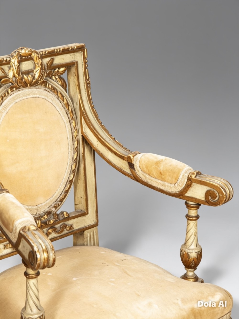 A pair of 19th-century French Louis XVI style childrens salon armchairs featuring carved giltwood frames, oval medallion backs with crests, fluted legs, and gold velvet seats. View VI
