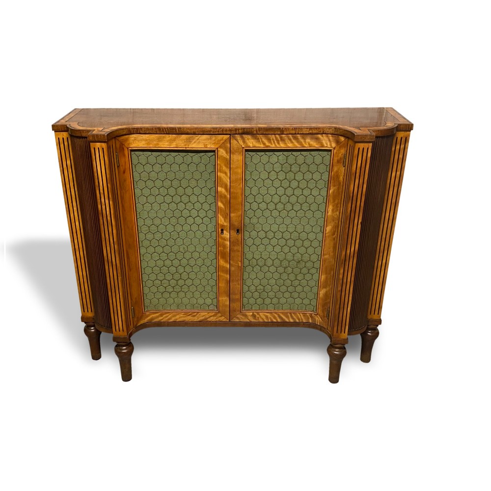 A Georgian satinwood side cabinet featuring two wire-mesh panelled doors lined with green fabric, flanked by fluted pilasters on turned legs. View III