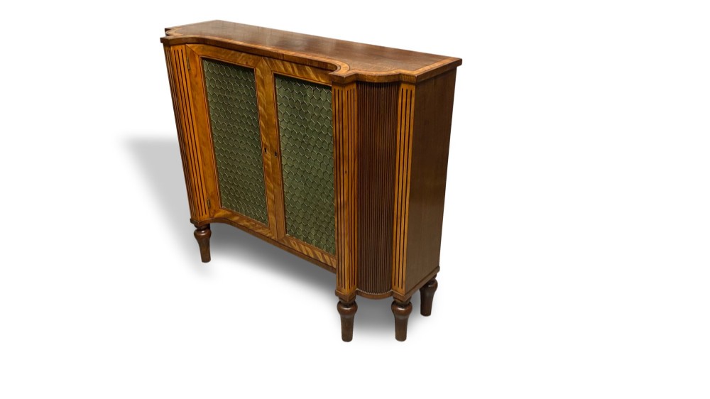 A Georgian satinwood side cabinet featuring two wire-mesh panelled doors lined with green fabric, flanked by fluted pilasters on turned legs. View V