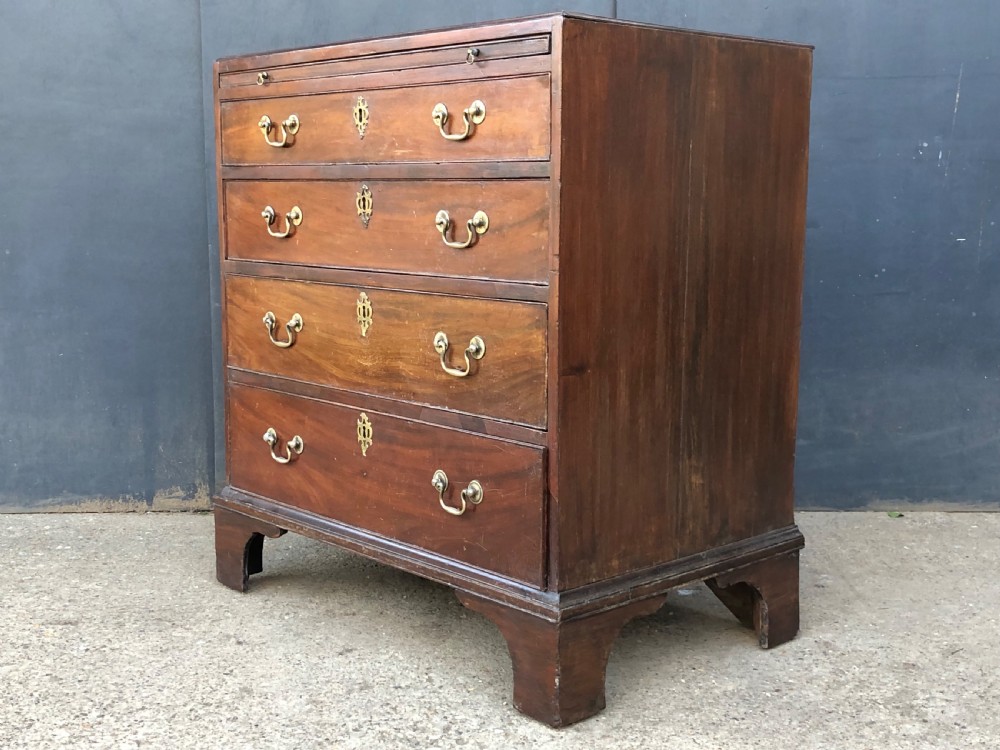 Caddy top mahogany bachelors chest with slide.