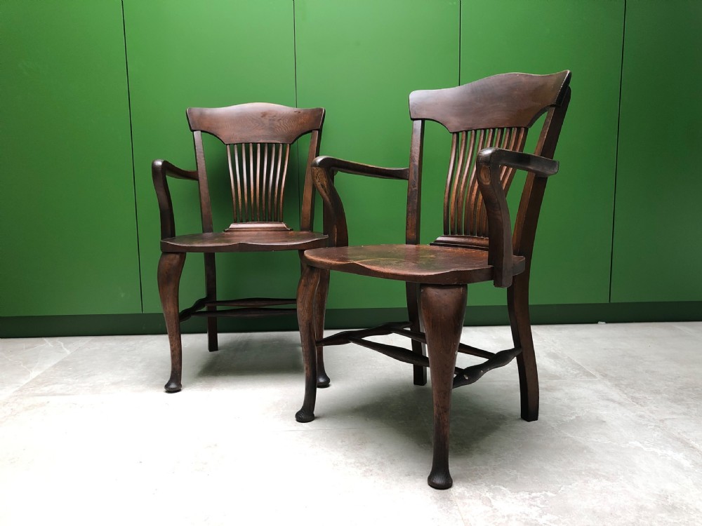 Pair of early 20th century oak desk chairs by Simpoles of Manchester