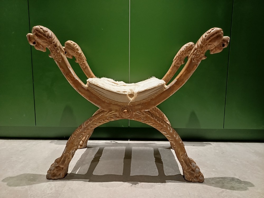 A giltwood curule window seat. View II