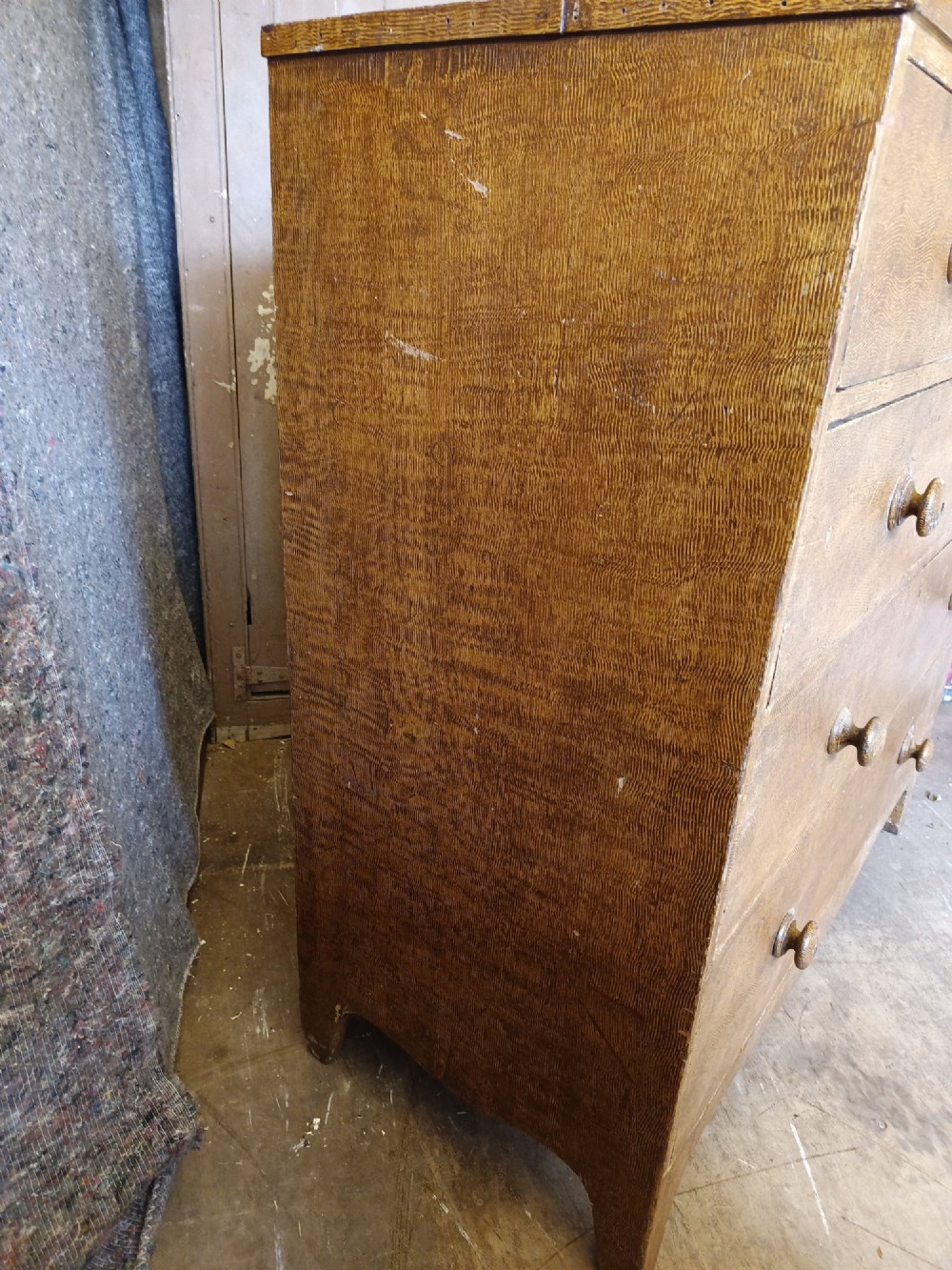 A Regency pine chest of drawers featuring a two-over-three drawer configuration, turned wooden knobs, and a shaped apron bottom. View VIII