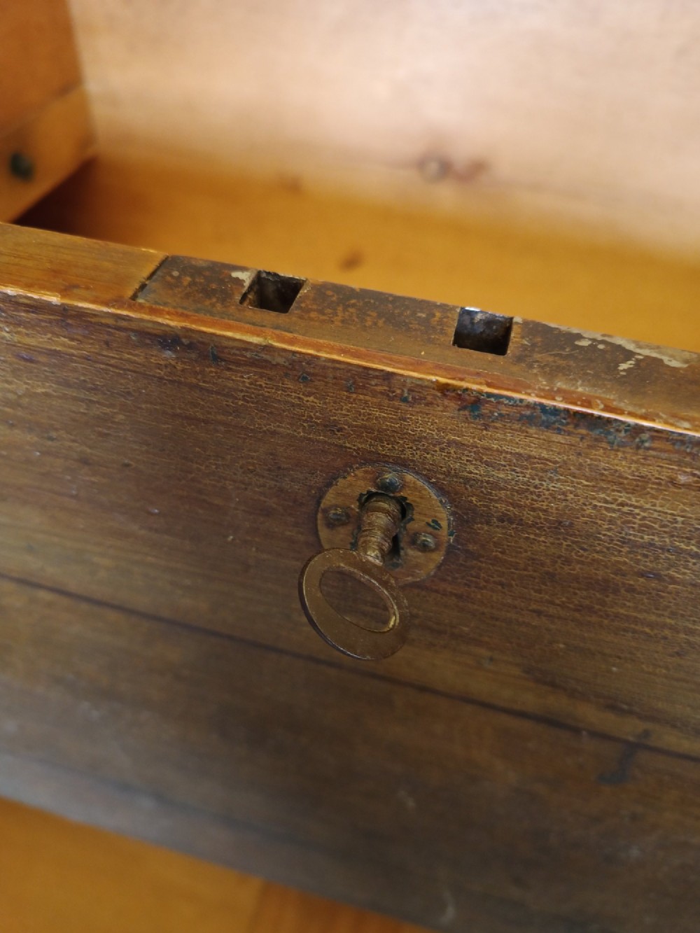 An early 19th-century painted pine mule chest featuring a top hinged coffer lid, a single lower drawer with two turned wooden knobs, and keyhole escutcheons. View IV