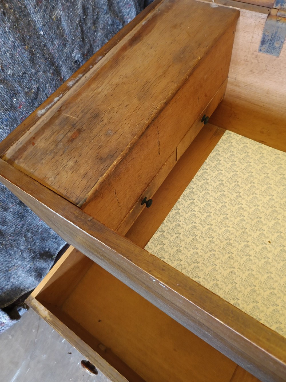An early 19th-century painted pine mule chest featuring a top hinged coffer lid, a single lower drawer with two turned wooden knobs, and keyhole escutcheons. View VI