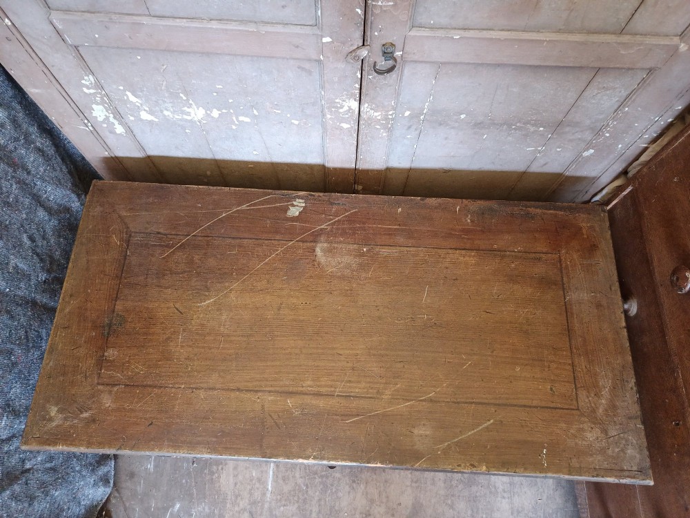 An early 19th-century painted pine mule chest featuring a top hinged coffer lid, a single lower drawer with two turned wooden knobs, and keyhole escutcheons. View IX