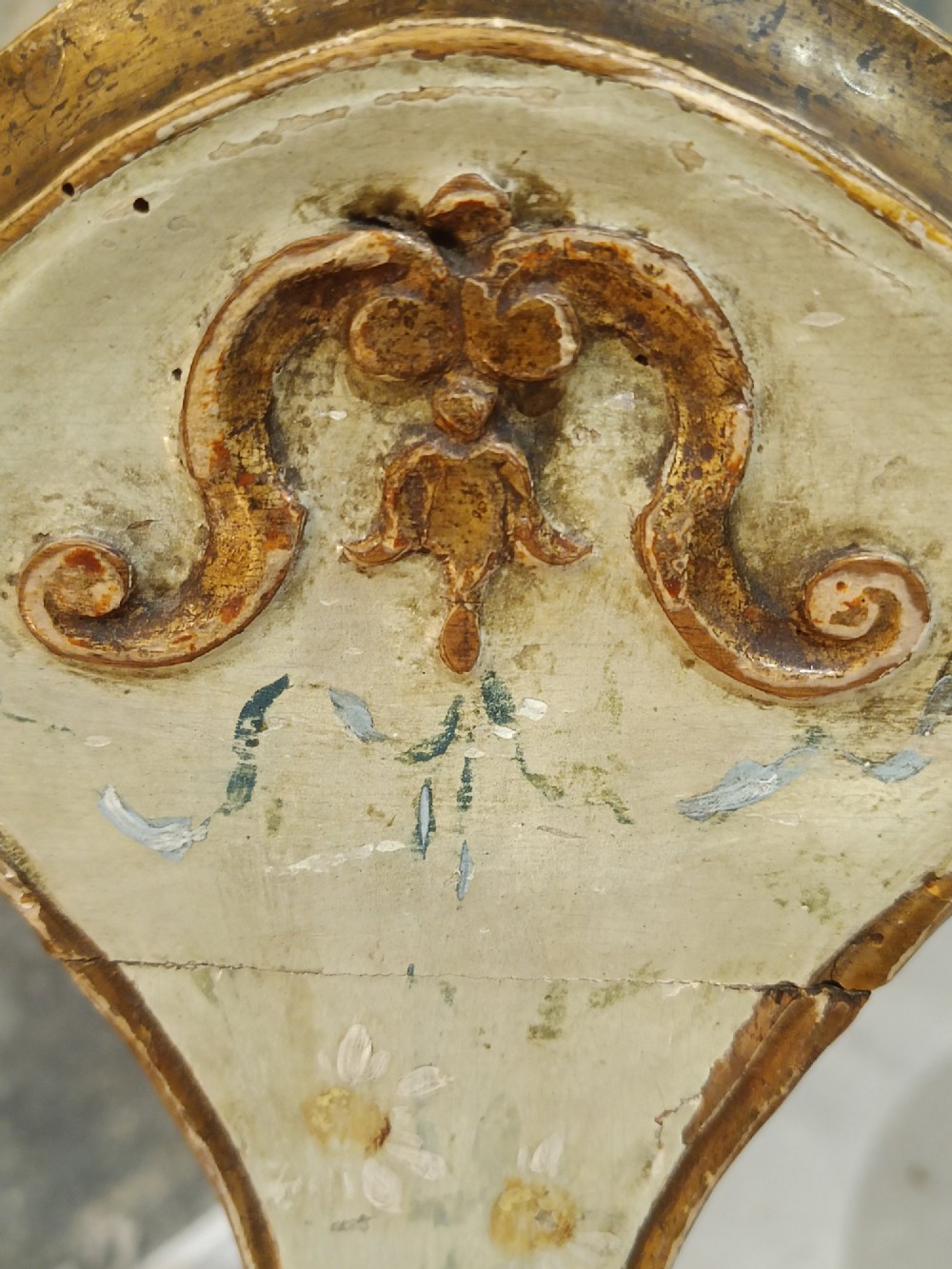 A pair of 18th-century North Italian side chairs featuring distressed cream painted frames with carved crests, cabriole legs, and red velvet seats. View IV