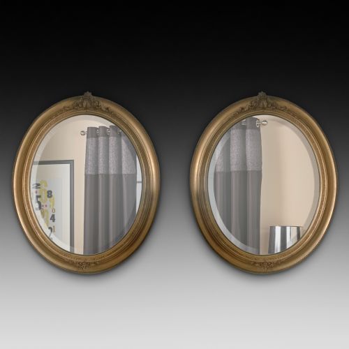 Pair of Edwardian Giltwood Oval Mirrors