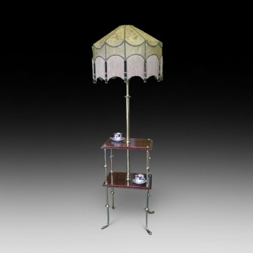 An Edwardian Rosewood Two Tier Standard Lamp Table