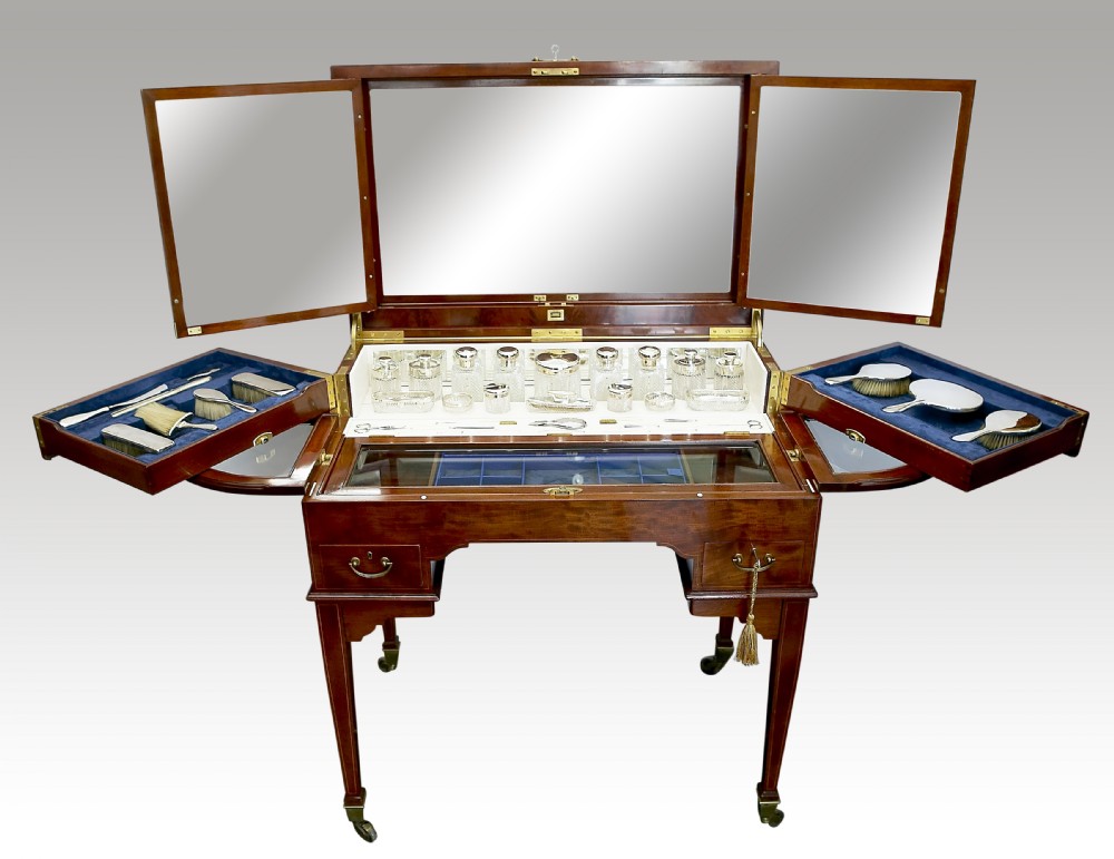 AN EDWARDIAN ORMOLU-MOUNTED MAHOGANY ENCLOSED DRESSING TABLE