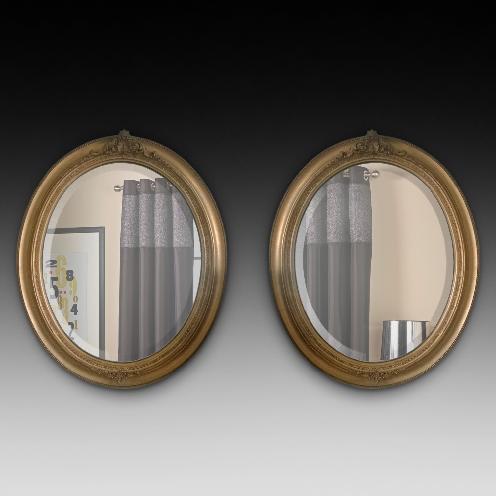 Pair of Edwardian Giltwood Oval Mirrors