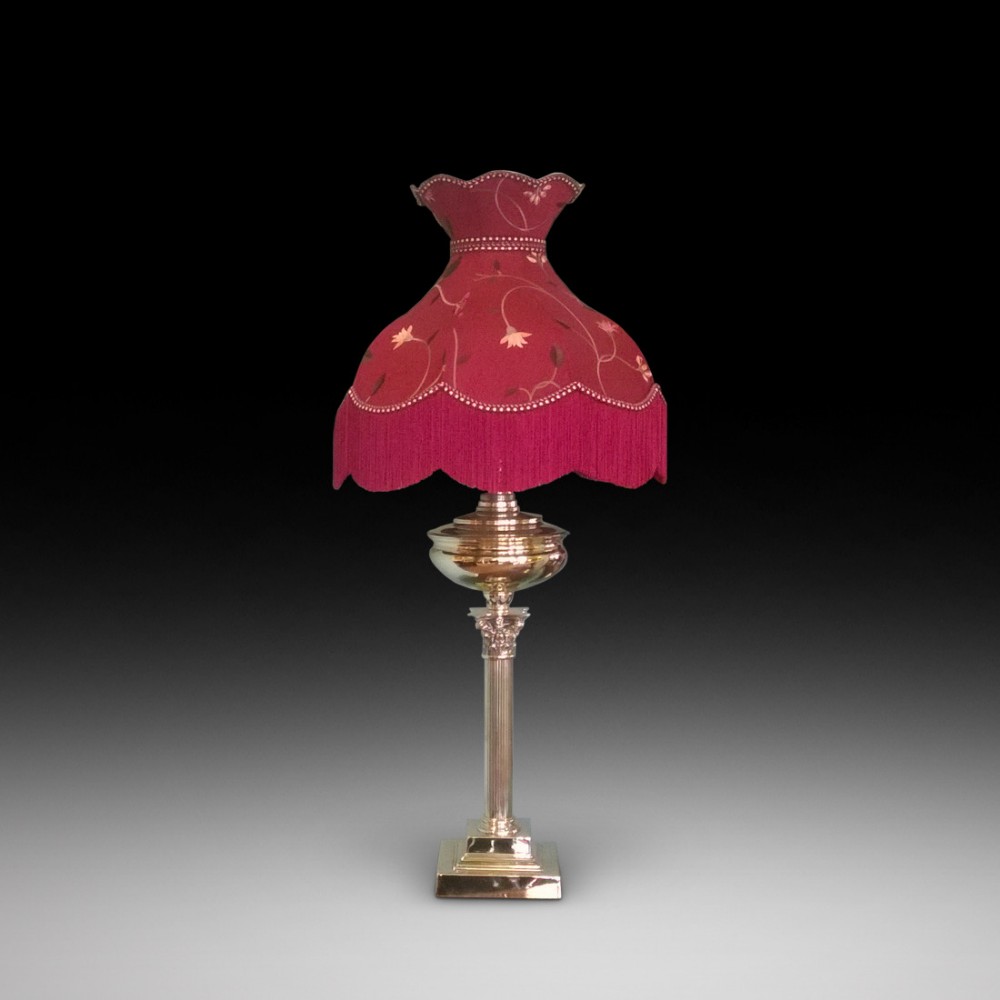 A Victorian brass Corinthian column oil lamp